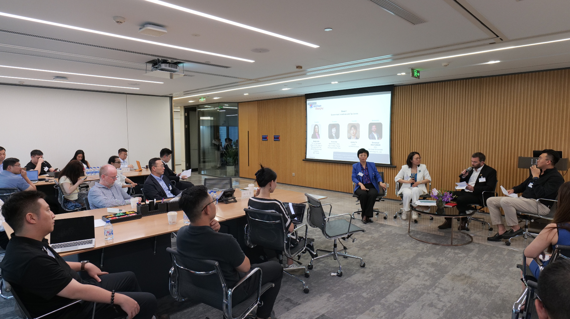 Wide view of the BritCham Shanghai green finance panel room at Llinks Law Offices with panellists and audience.