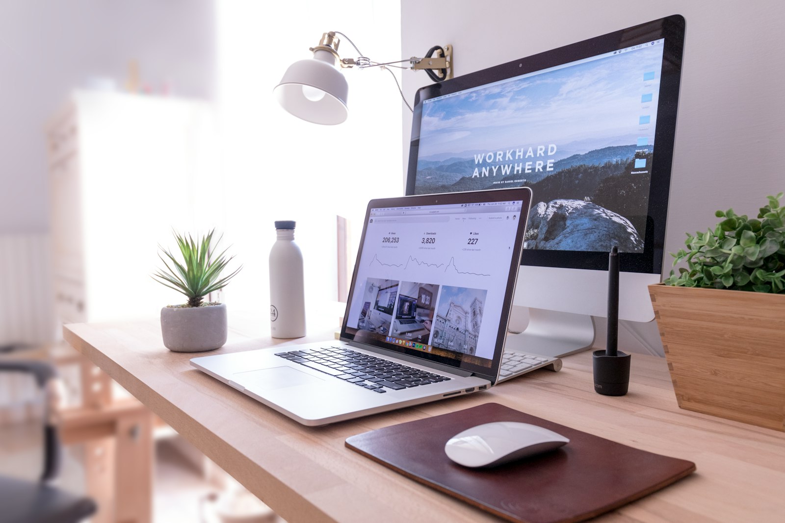 A laptop and external monitor on a home office desk