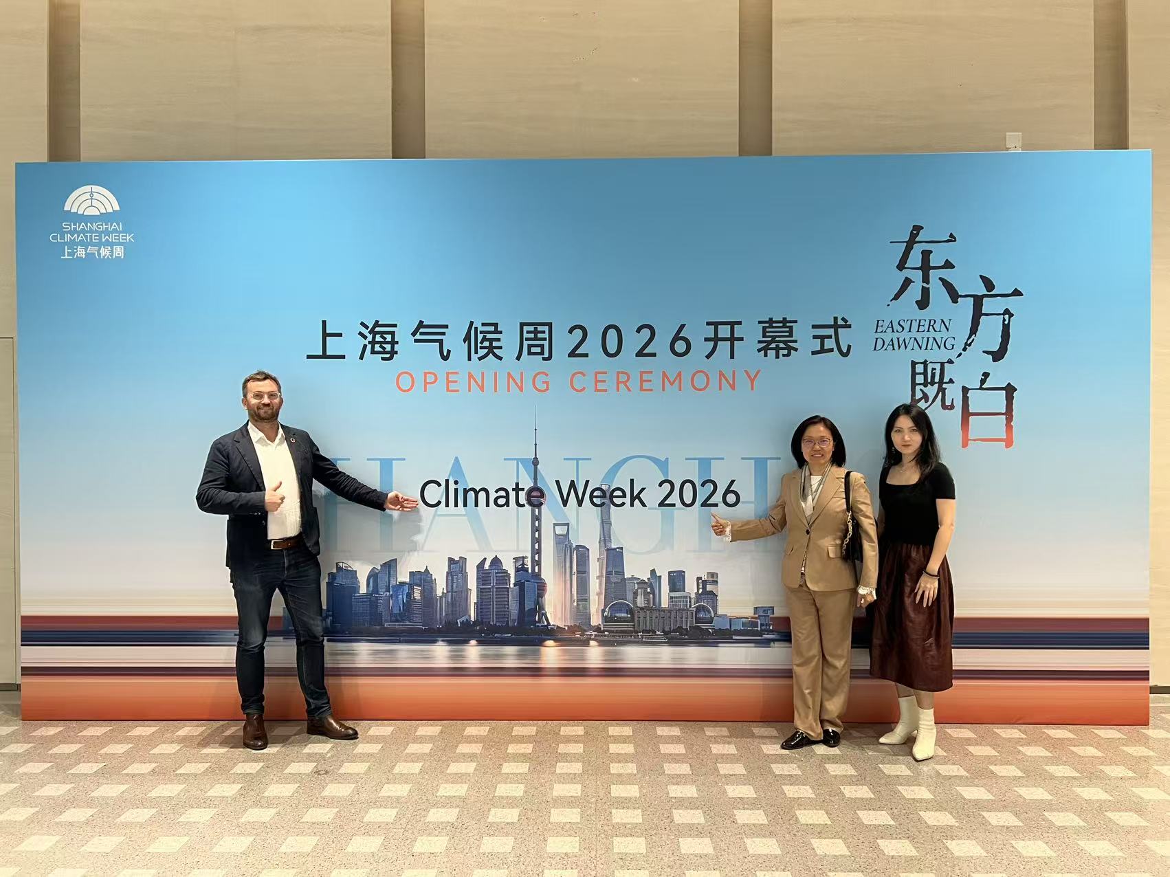 Shanghai Climate Week 2026 Opening Ceremony — BE-CAUSE team at the Eastern Dawning event backdrop